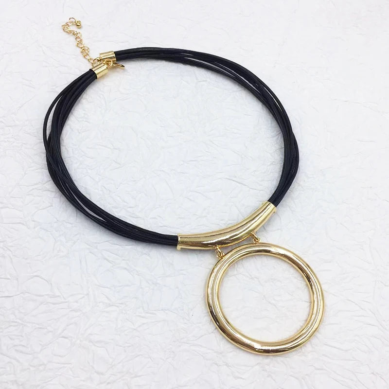 Gold Color Round Pendant on Multiple Black Leather Cords Necklace